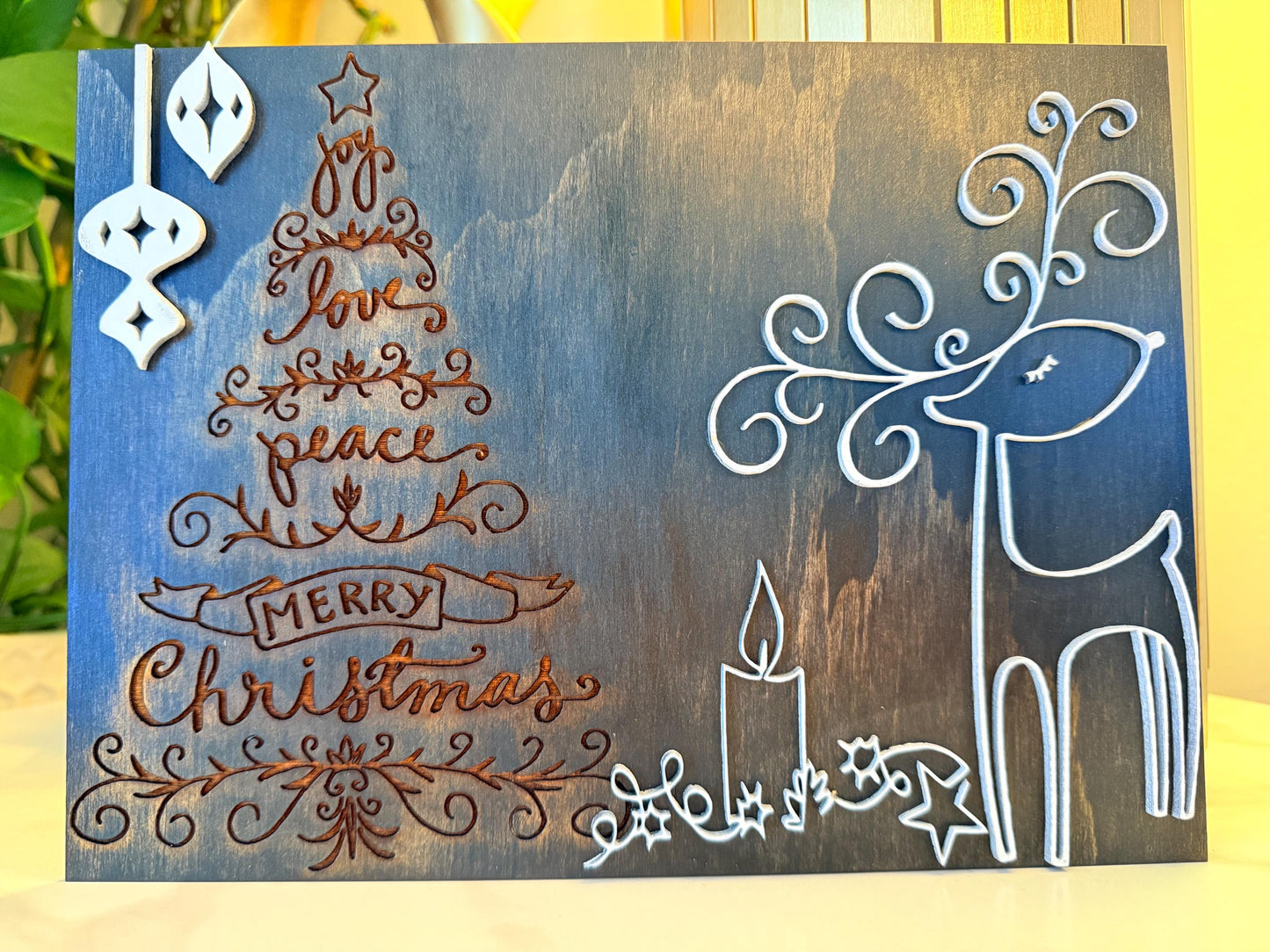 Bring warmth and festive charm to your home this holiday season with this handmade wooden Christmas wall art
