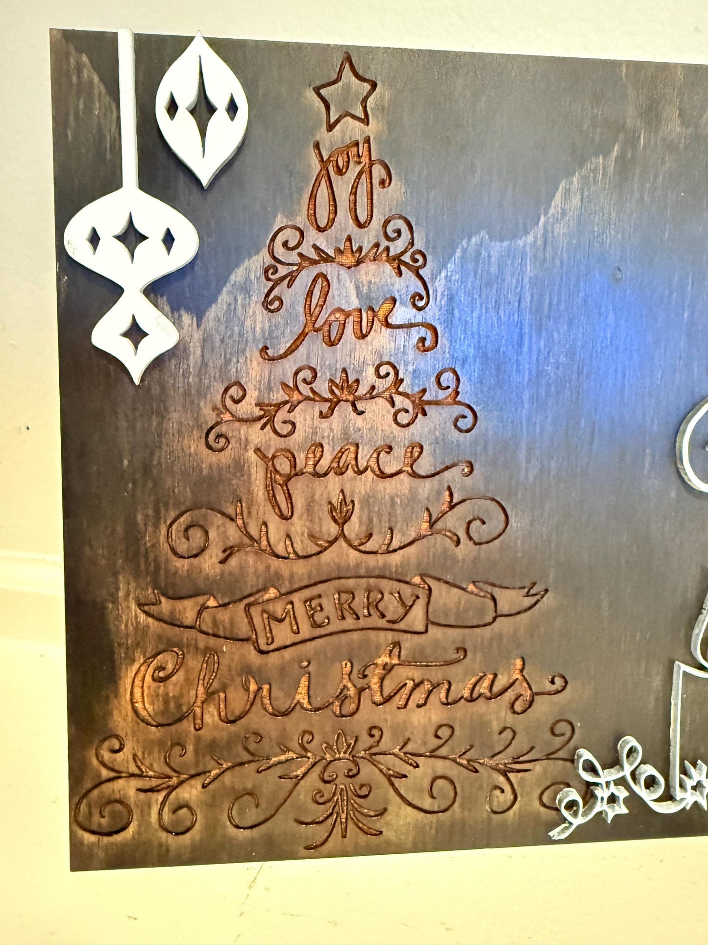 Bring warmth and festive charm to your home this holiday season with this handmade wooden Christmas wall art