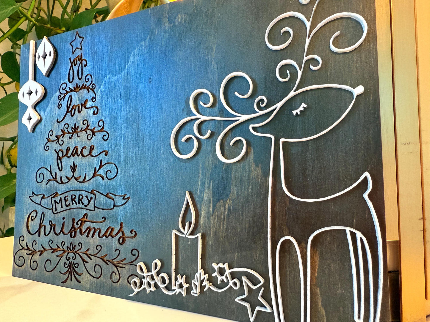 Bring warmth and festive charm to your home this holiday season with this handmade wooden Christmas wall art