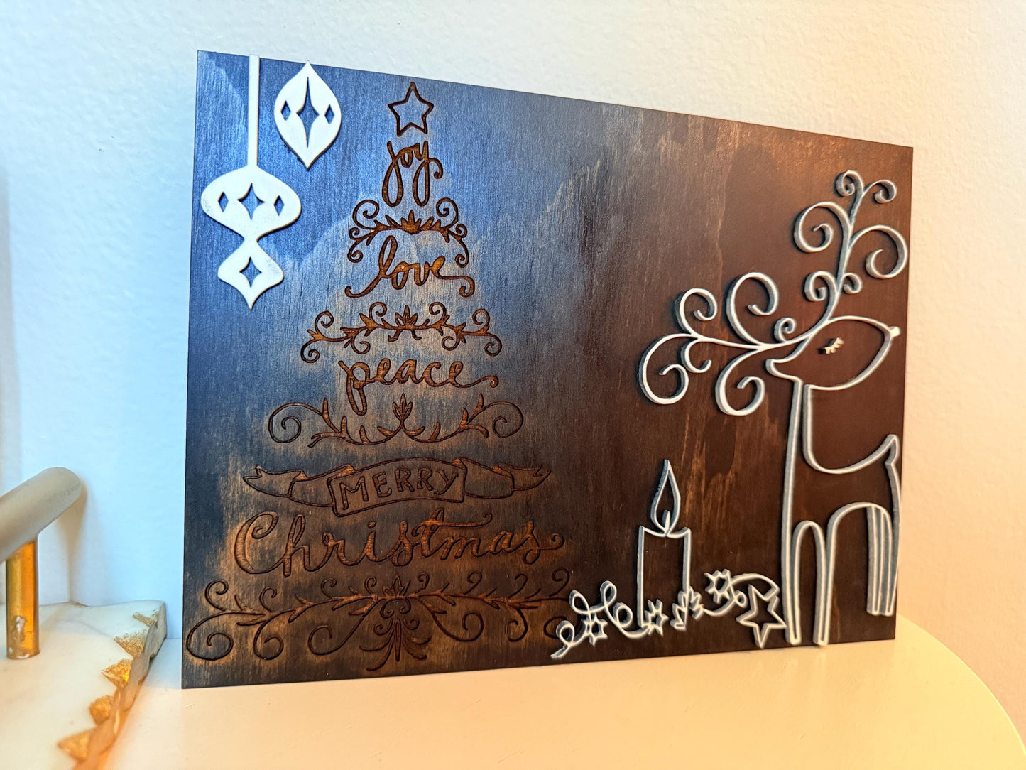 Bring warmth and festive charm to your home this holiday season with this handmade wooden Christmas wall art