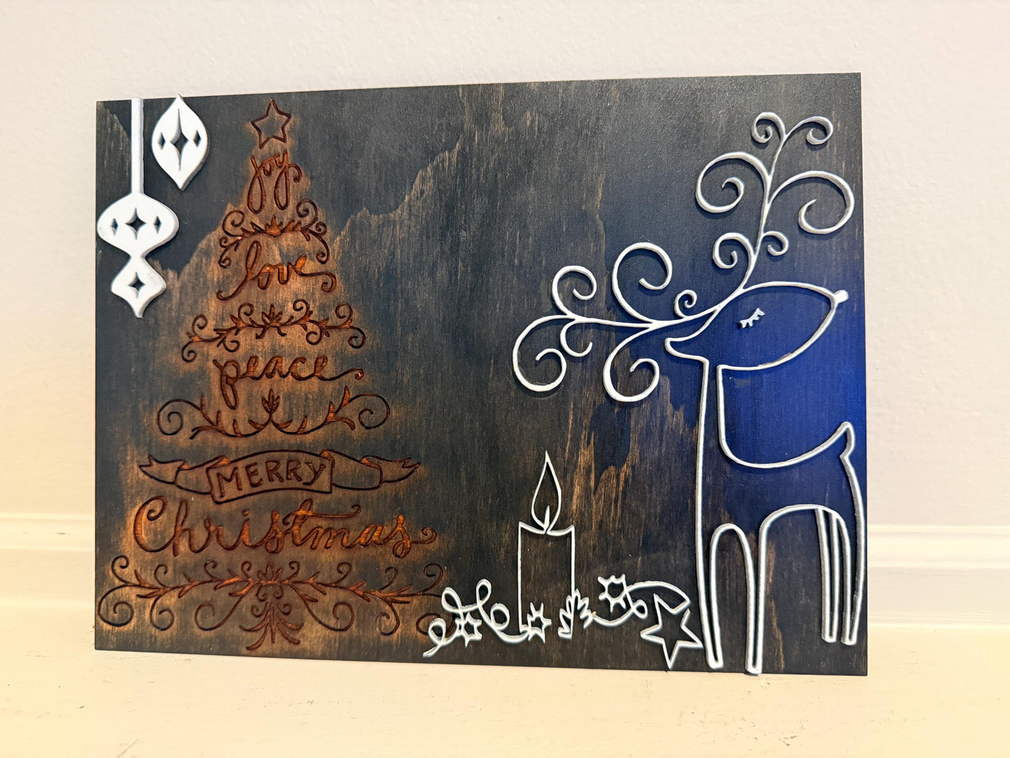 Bring warmth and festive charm to your home this holiday season with this handmade wooden Christmas wall art