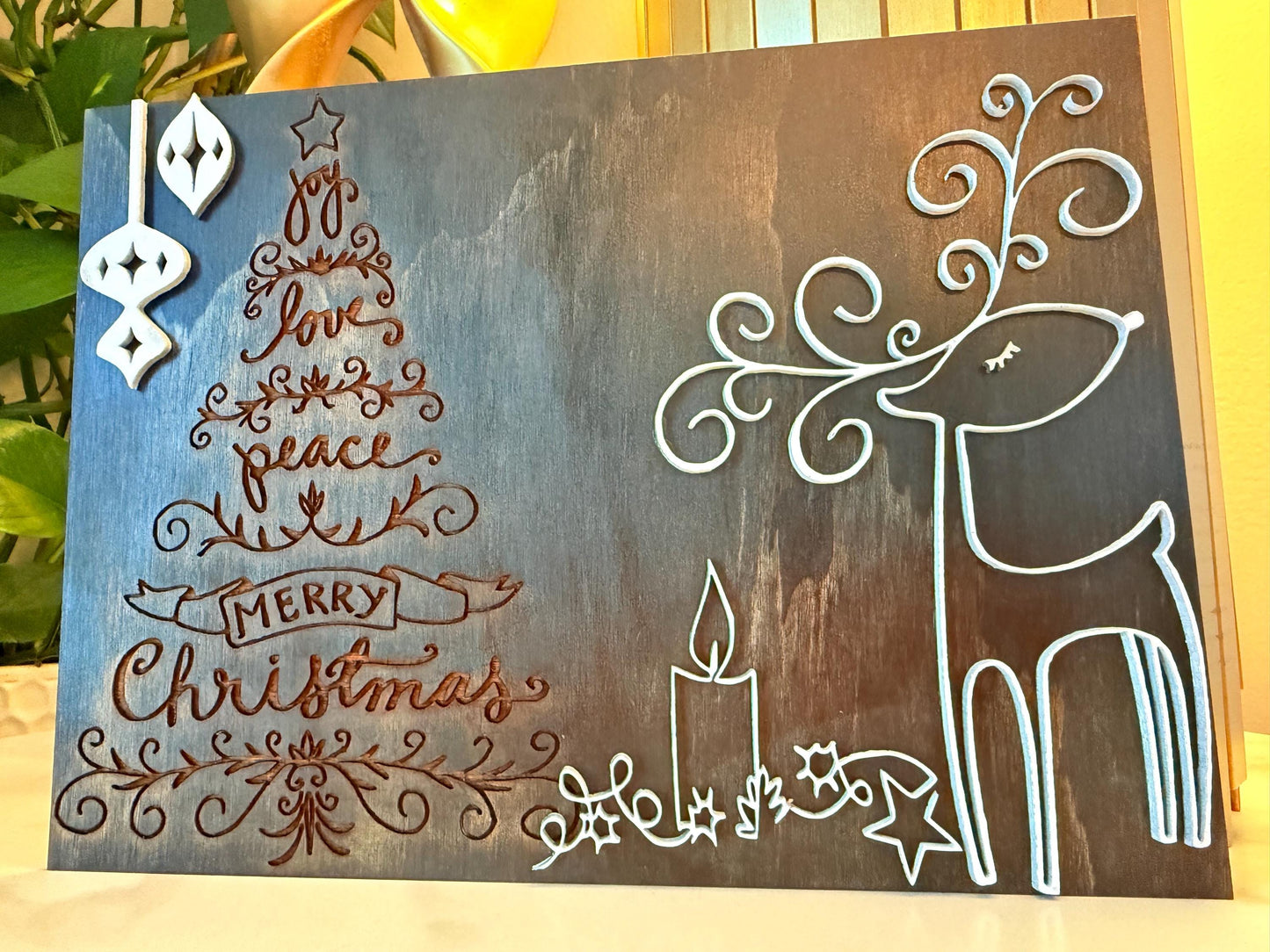 Bring warmth and festive charm to your home this holiday season with this handmade wooden Christmas wall art