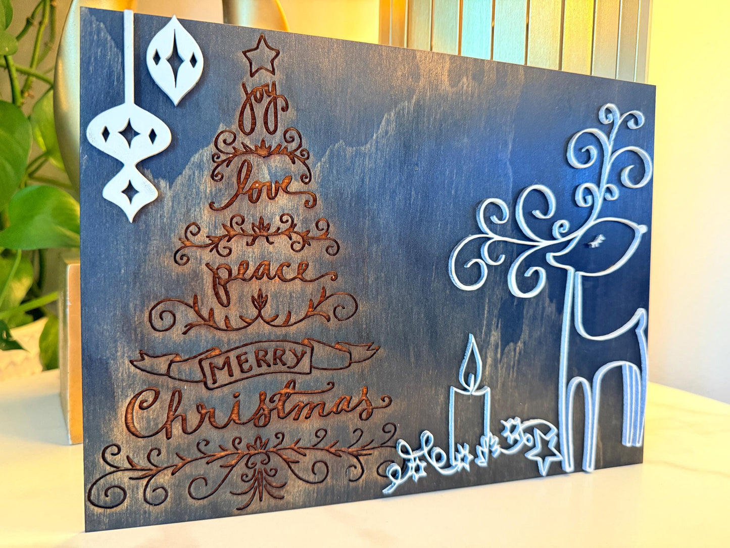 Bring warmth and festive charm to your home this holiday season with this handmade wooden Christmas wall art